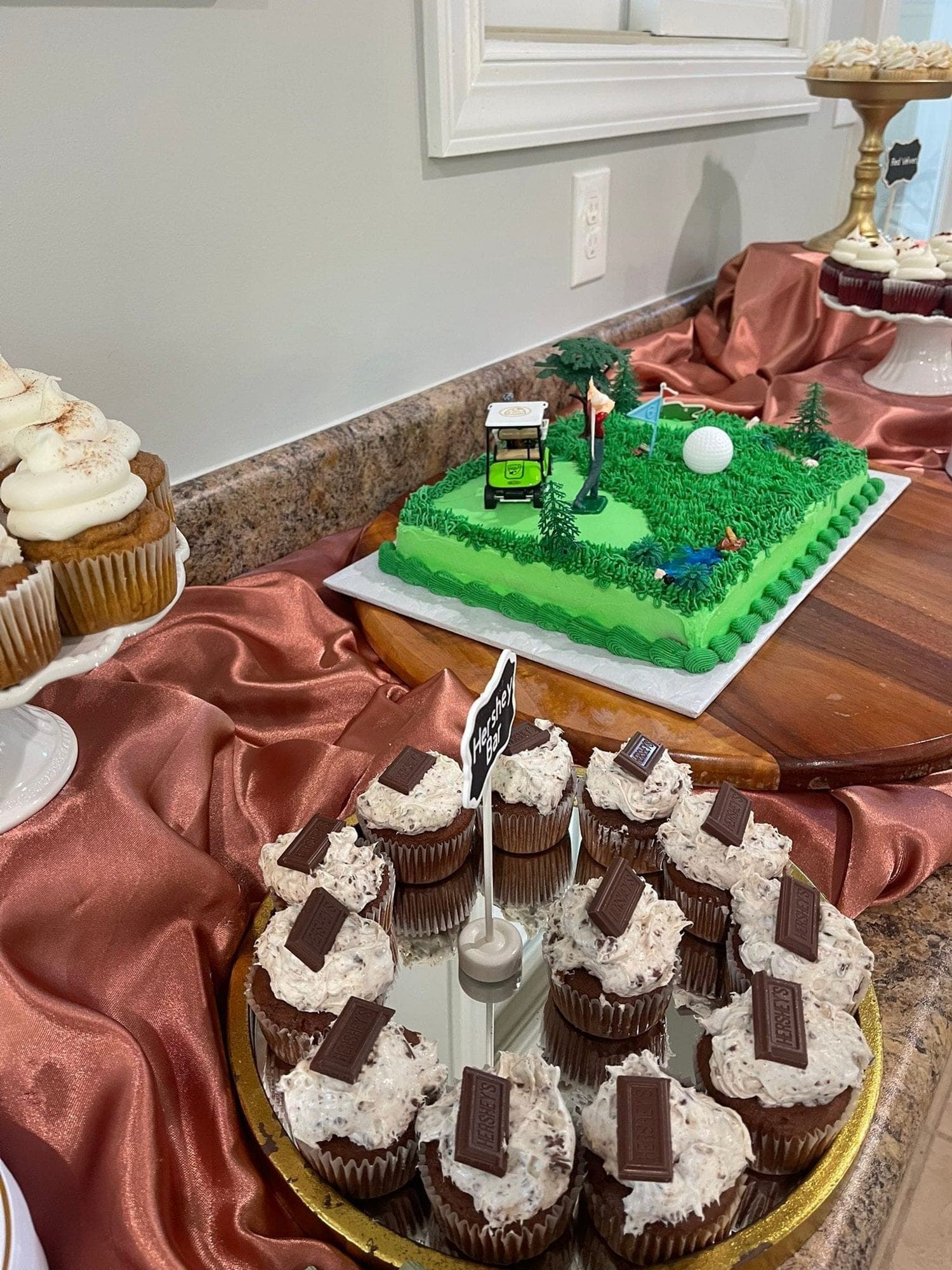 Golf-course sheet cake with cupcakes