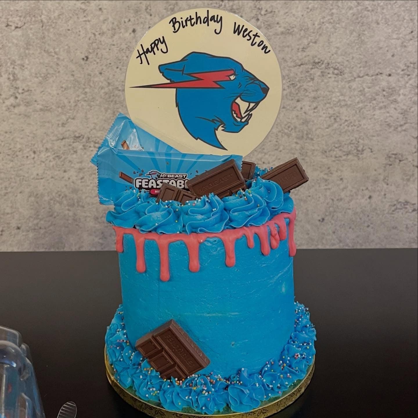 Mr. Beast birthday cake with blue buttercream drip