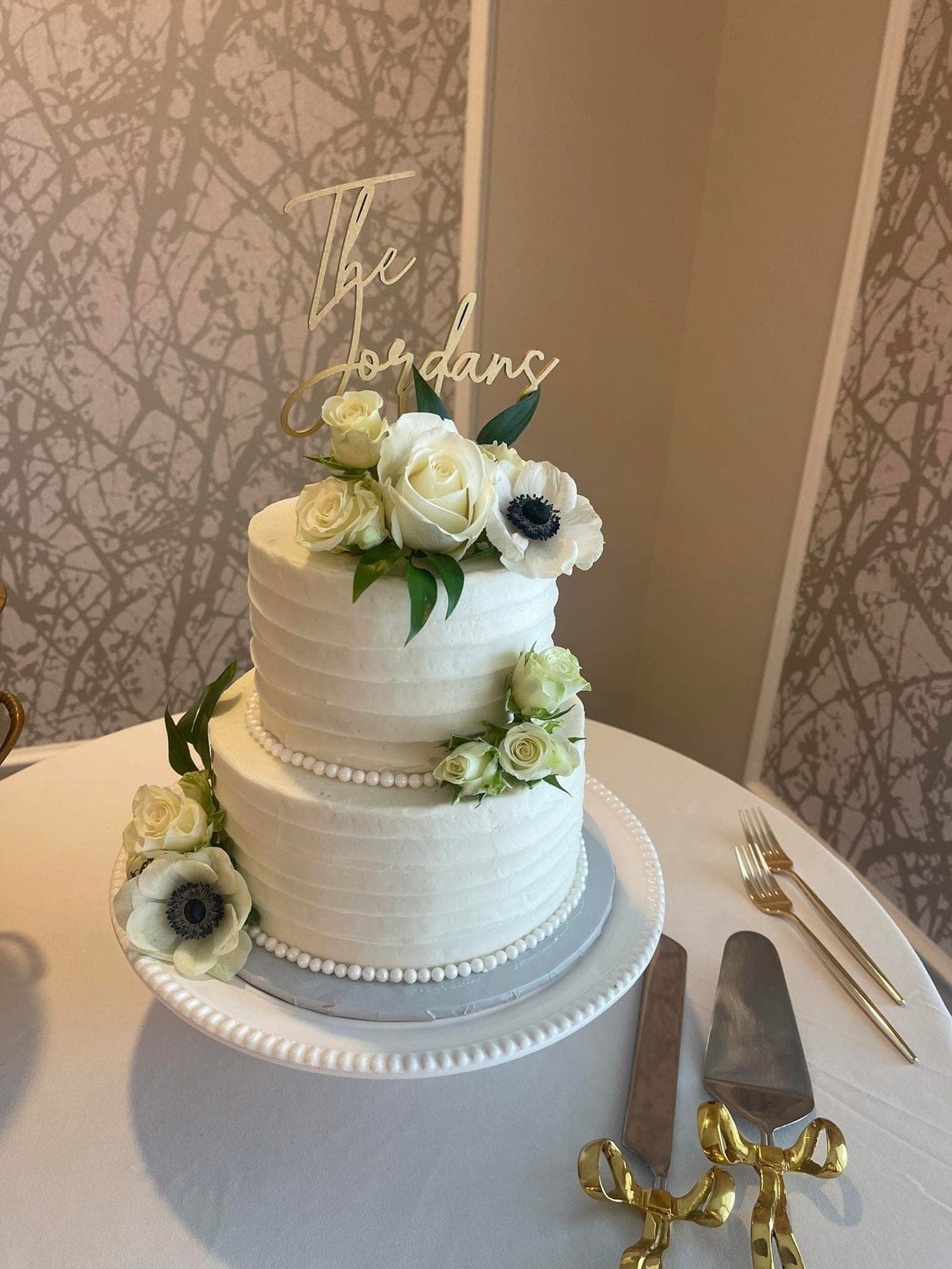 Classic white wedding cake with white roses